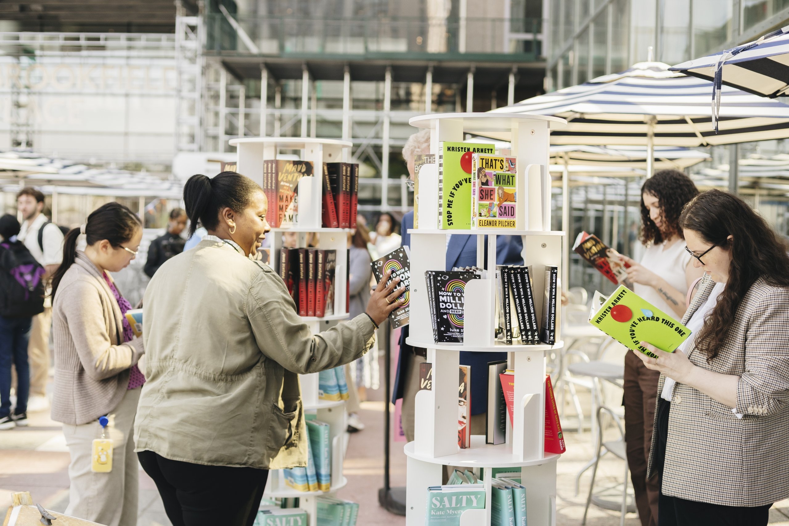 Women browsing books on display