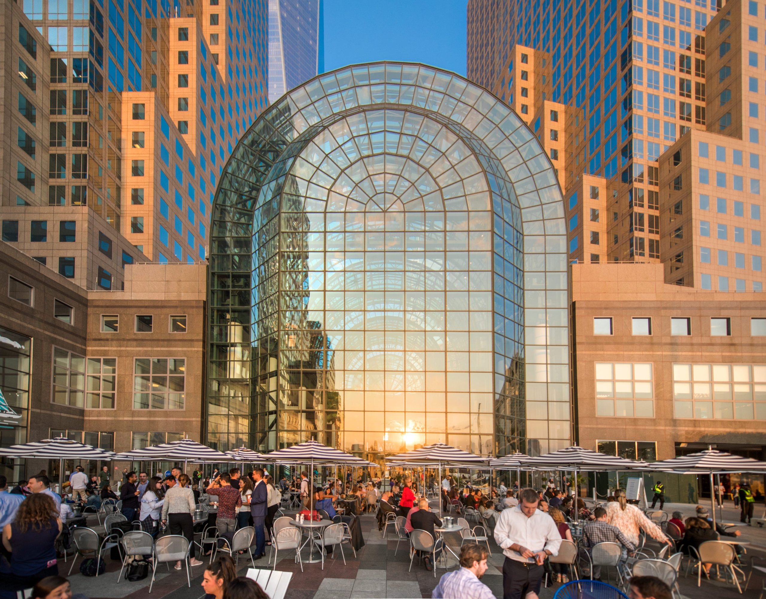 Brookfield Place exterior illuminated by sunset or golden hour lighting.