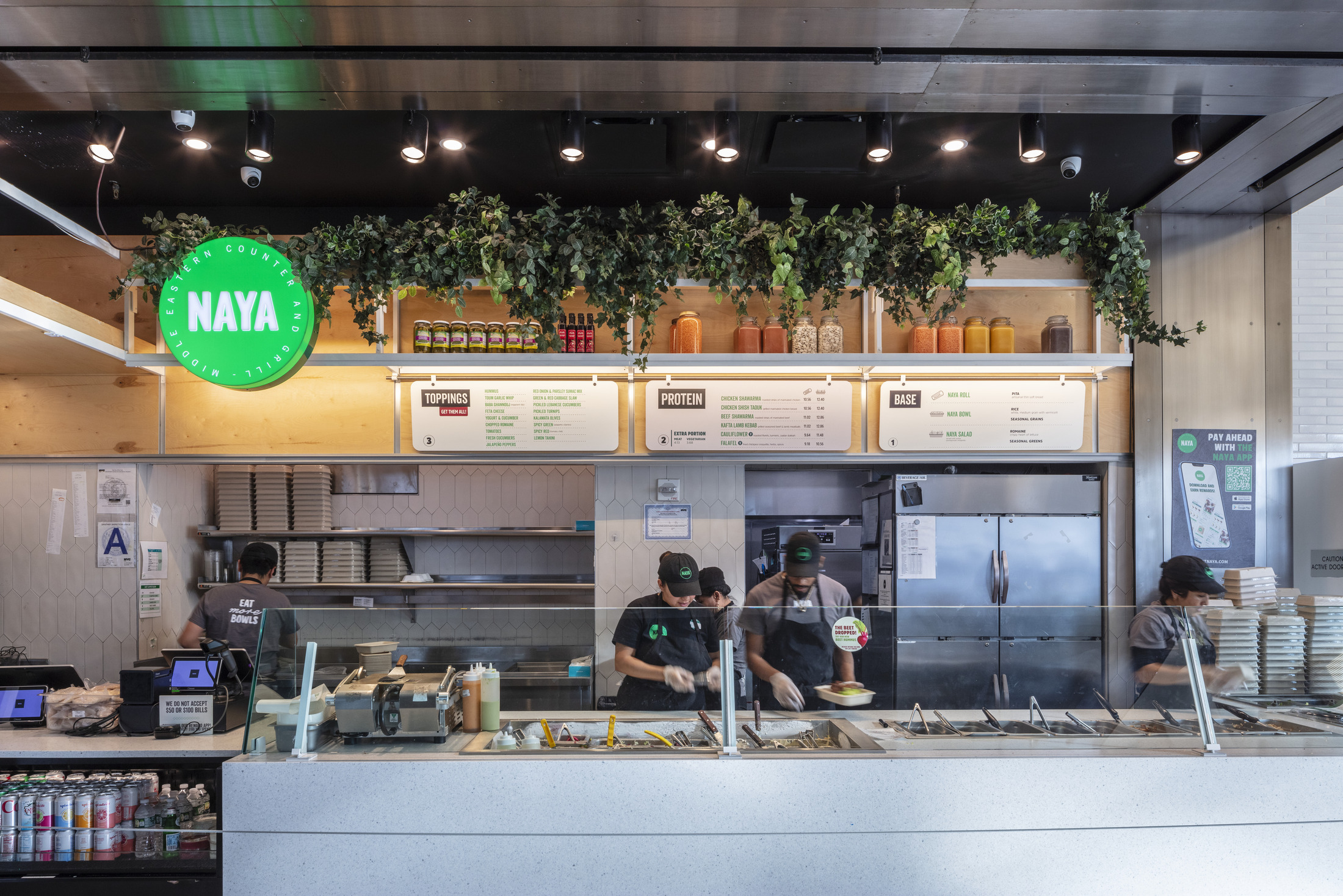 Naya fast food restaurant with a service counter and menu boards.