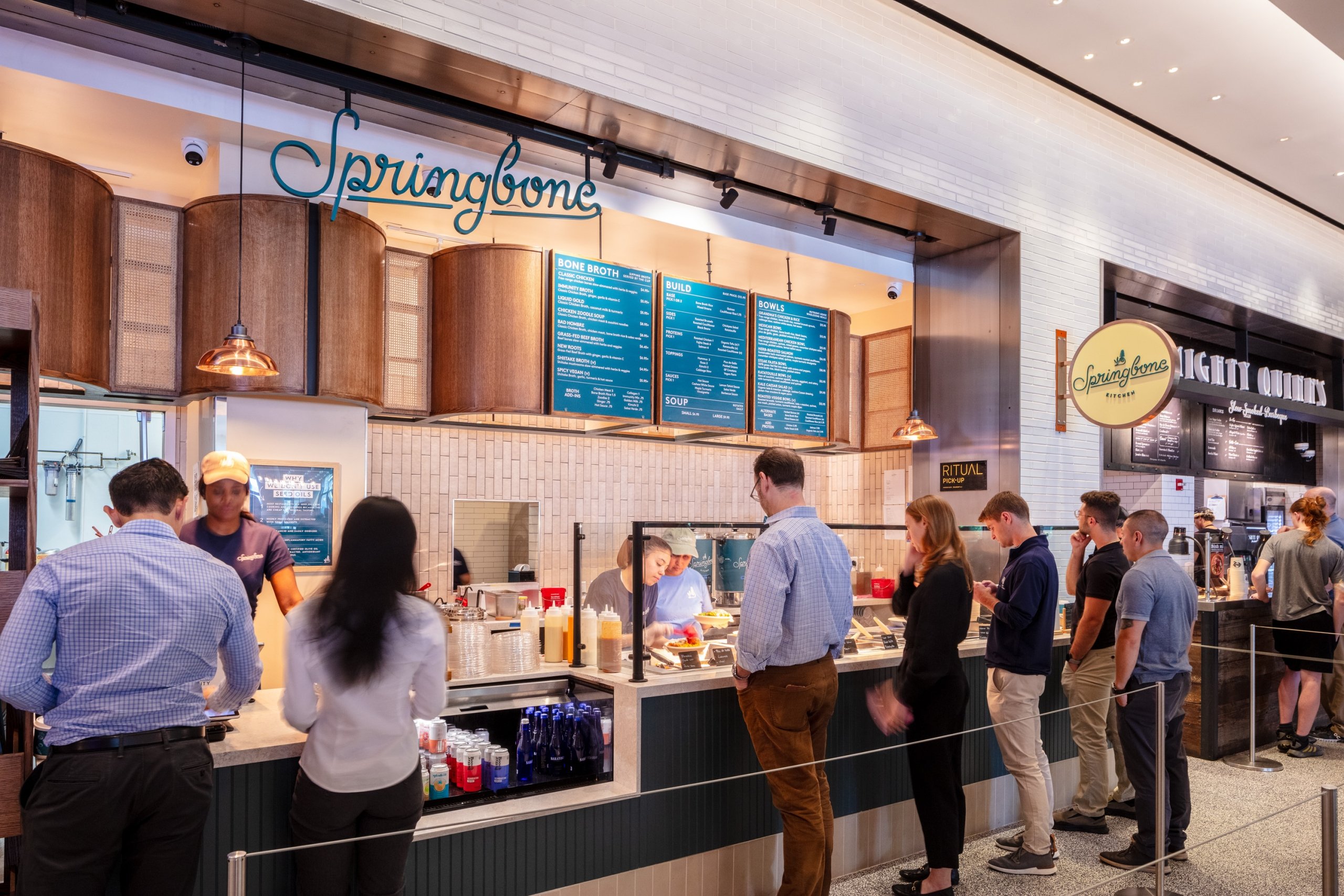 Counter area of Springbone with people lined up.