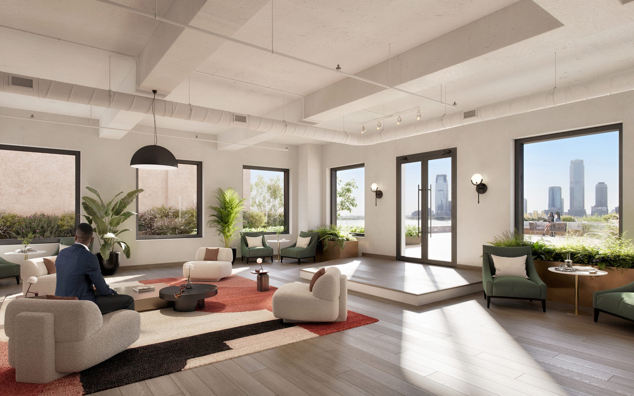 Bright, open-plan interior space with high ceilings, large windows, and casual seating areas with plants.